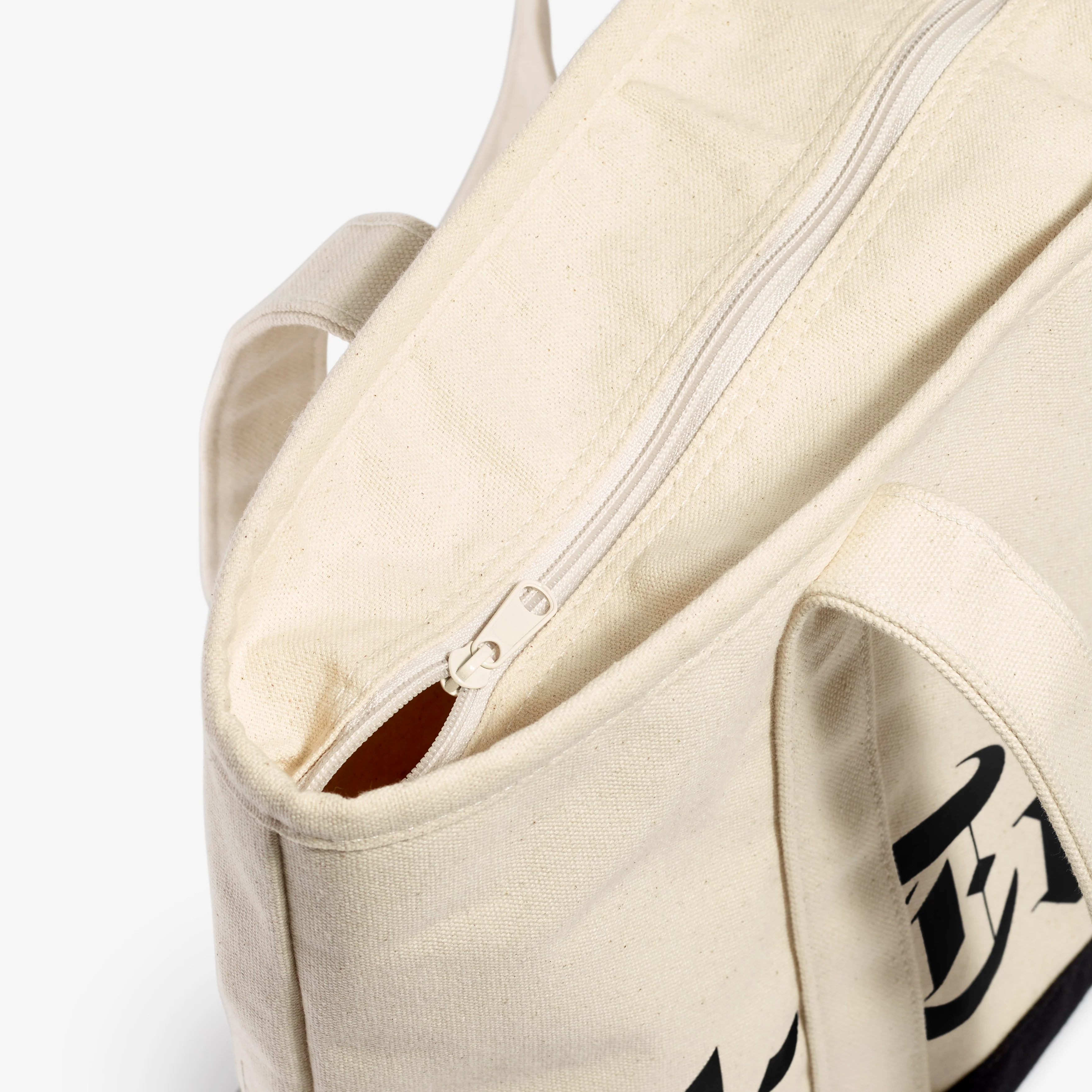 1583-wraparound-logo-zip-top-canvas-tote-5.webp Wraparound Logo Zip-Top Canvas Tote